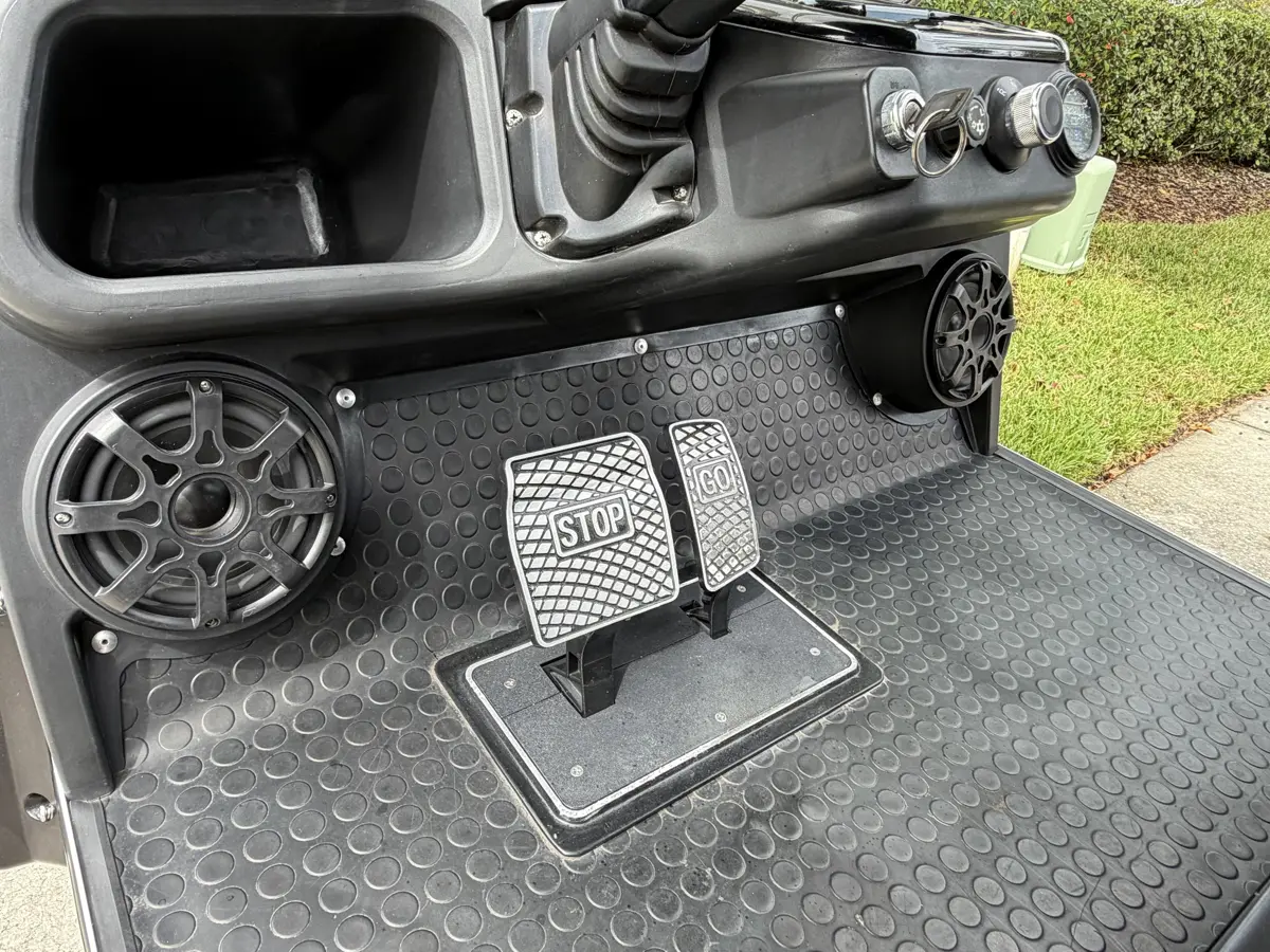 Rear-facing flip seat with grab bar and footrest