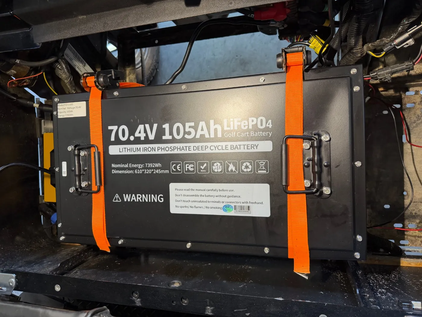 A 70.4-volt 105 amp-hour lithium battery installed in a cart