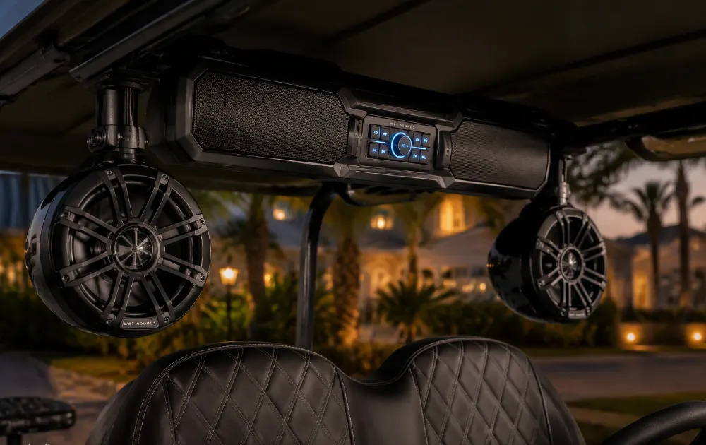 Tower speakers mounted on a golf cart roof